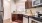 a kitchen with wooden cabinets