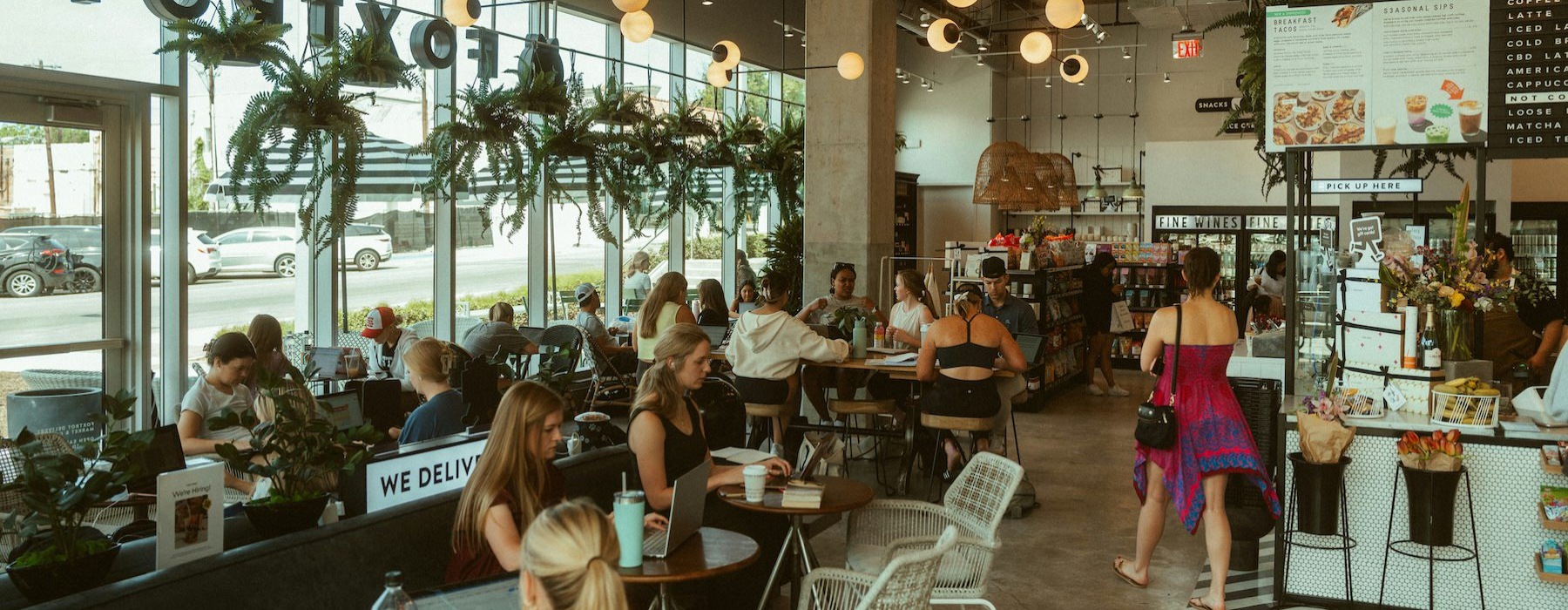 a group of people sitting at tables